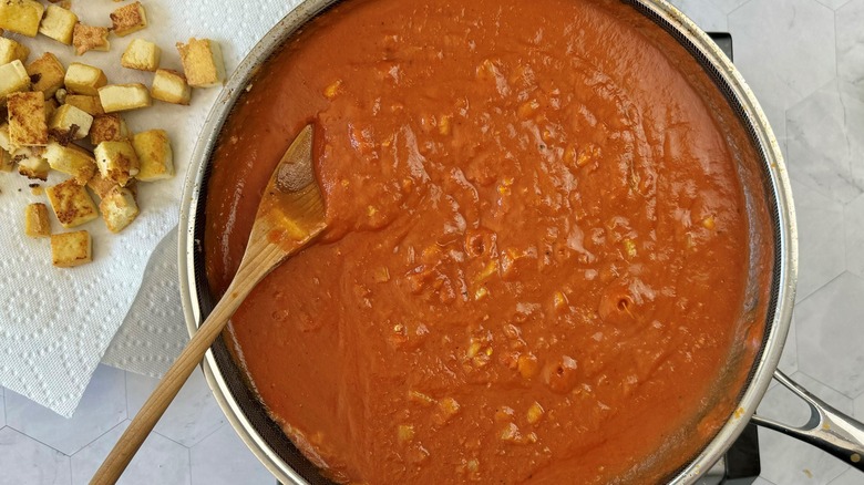 tomato sauce in black frying pan