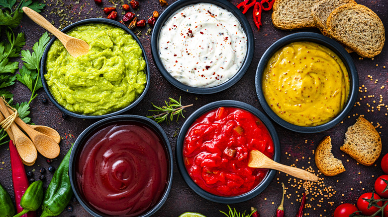 A selection of five different sauces is on display.