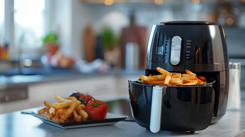 An air fryer full of french fries