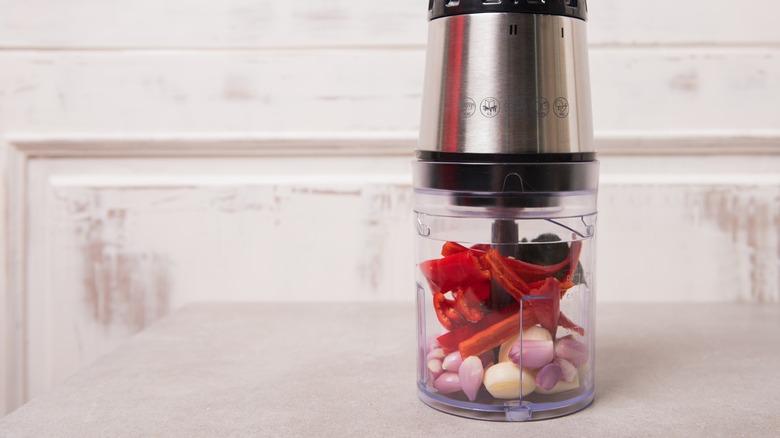 shallots, garlic, and red pepper in a blender