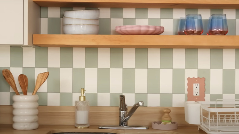 Photo of trendy kitchenette with peel-and-stick backsplash