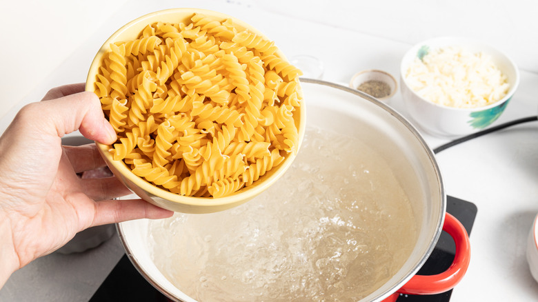 Fusilli pasta added to boiling water