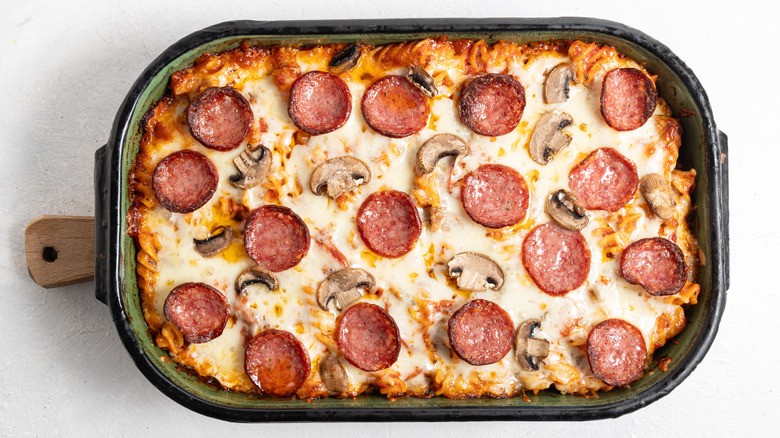 Baked pasta with cheese, pepperoni, and mushrooms