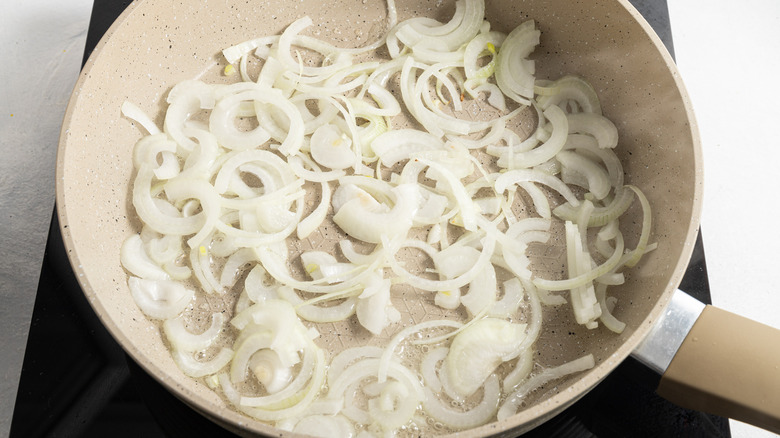 sliced onion cooking in pan