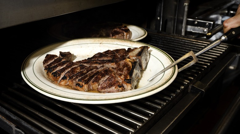 Steak cooking on broiler