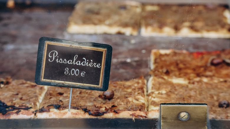 Pissaladiere for sale with sign