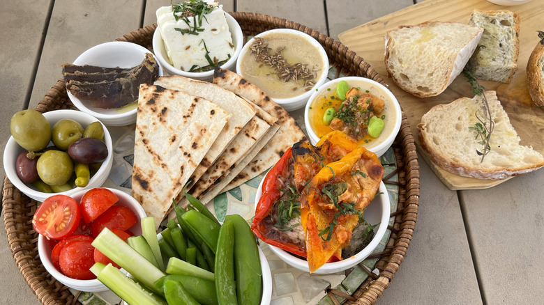 Flatbread with an array of dips and crudites