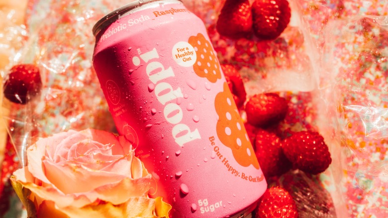 A can of Poppi soda with raspberries and rose