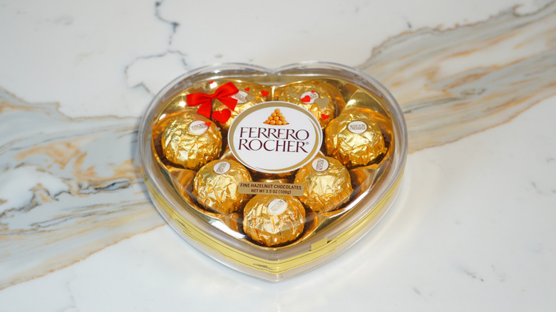 A closed heart-shaped Ferrero Rocher box