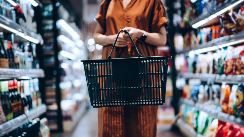 Woman carrying grocery basket