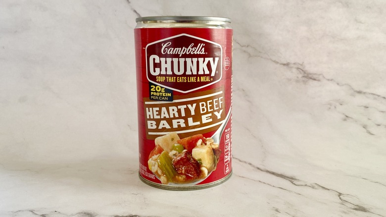 Campbell's Chunky Hearty Beef Barley soup can on counter