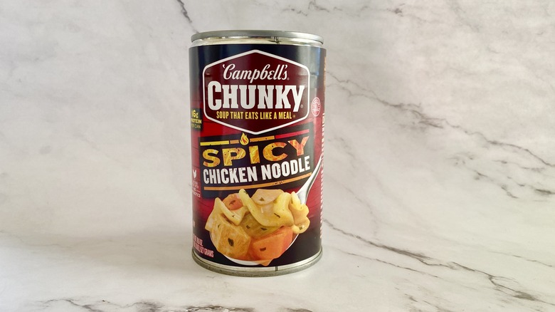 Campbell's Chunky Spicy Chicken Noodle soup can on counter