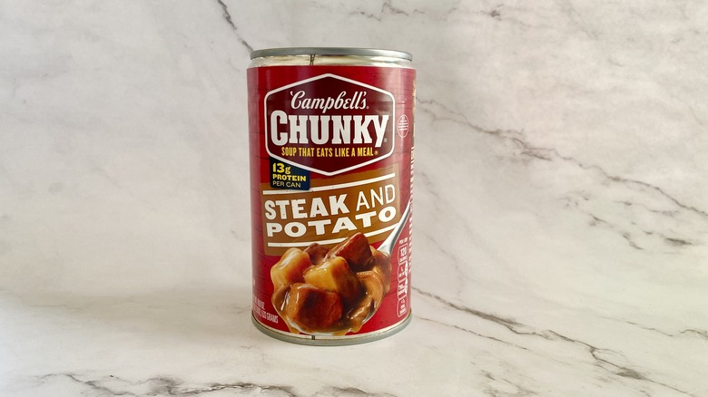 Campbell's Chunky Steak and Potato soup can on counter