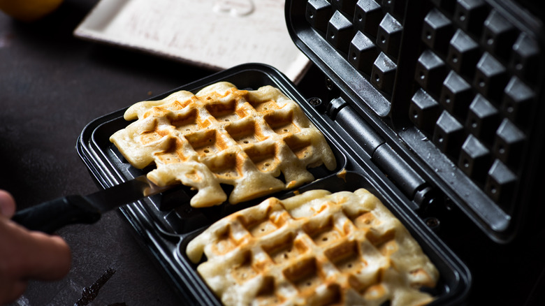 Waffle on iron with spatula