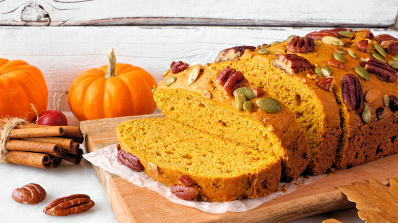 pumpkin bread topped with nuts and seeds