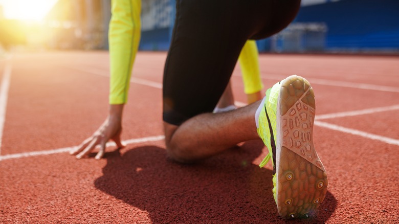 Runner poised to start race