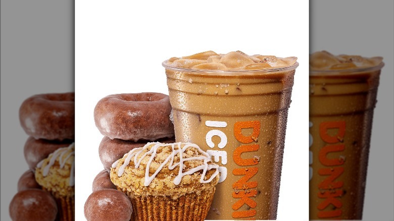 A Dunkin' pumpkin spice family: coffee, donut, donut holes