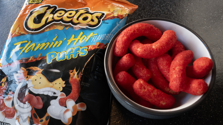 Bag and bowl of Flamin' Hot Cheetos puffs