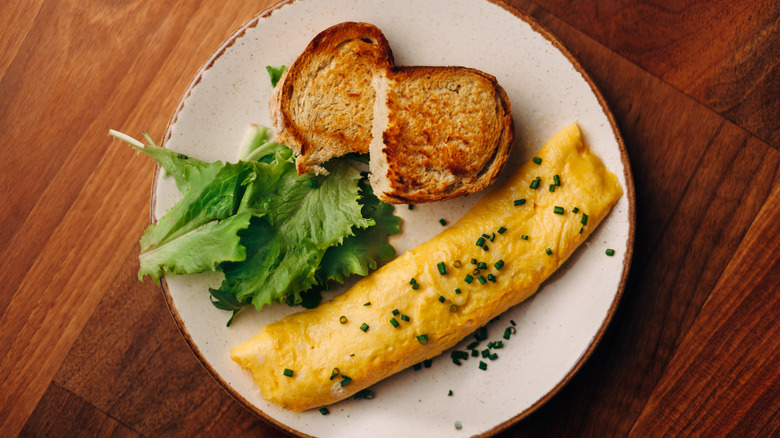 rectangular omelet with toast and greens