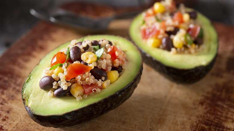 avocado stuffed with quinoa, corn, tomato, beans