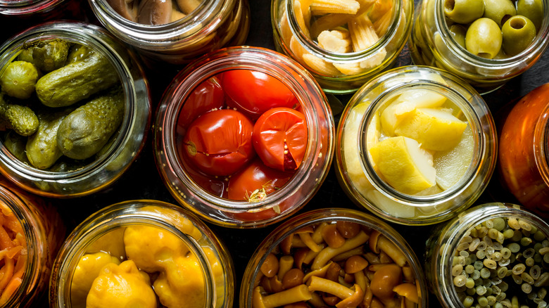 Pickled vegetables of all kinds in open jars