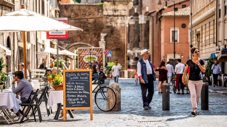 Italian street with pedestrians and eateries