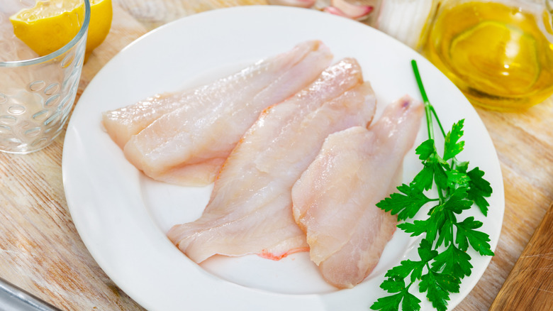 filets of white fish (rockfish) on white plate