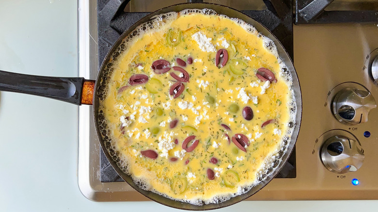 olive frittata mixture on stove