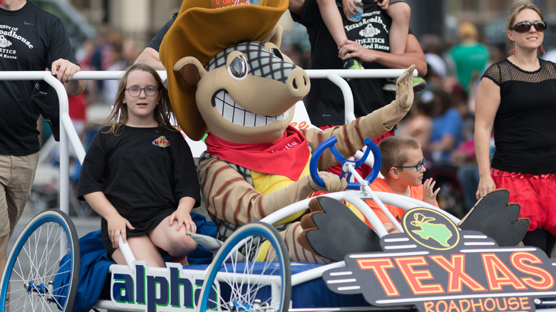 Texas Roadhouse float and armadillo mascot