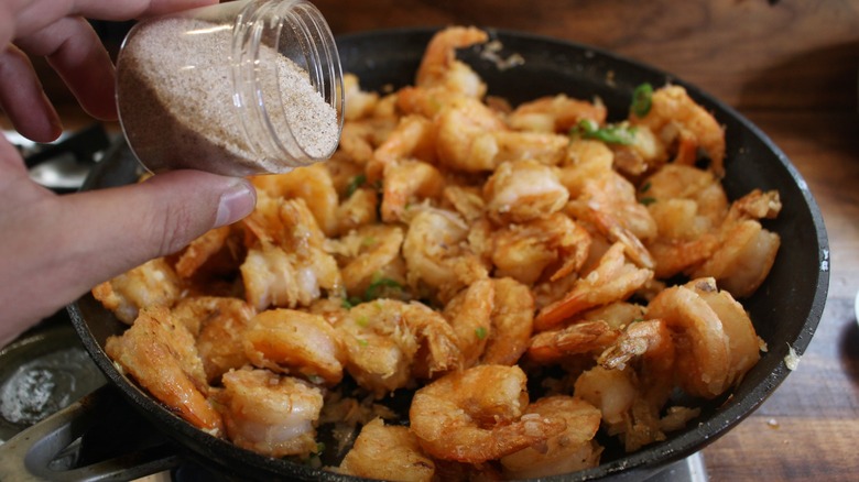 seasoning shrimp in pan