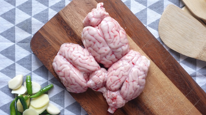 Lamb brains on wooden cutting board