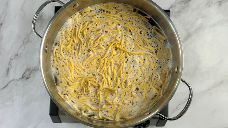 noodles in pot of water