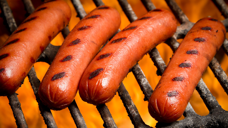 hot dogs on a grill