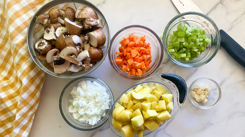 chopped vegetables in glass bowls