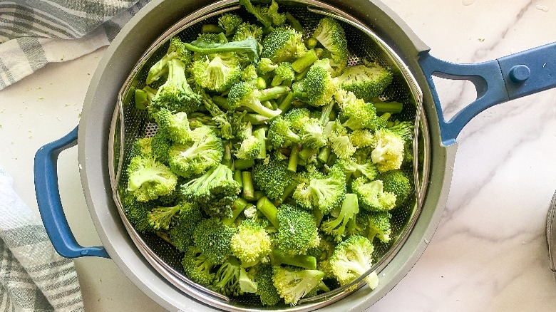 broccoli and asparagus in frying pan