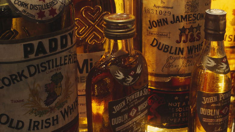 bottles of Irish whiskey with gold lighting