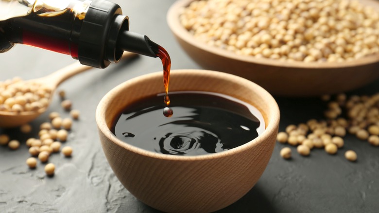 Soy sauce being poured into a bowl