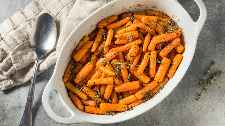 Baking dish of cooked baby carrots