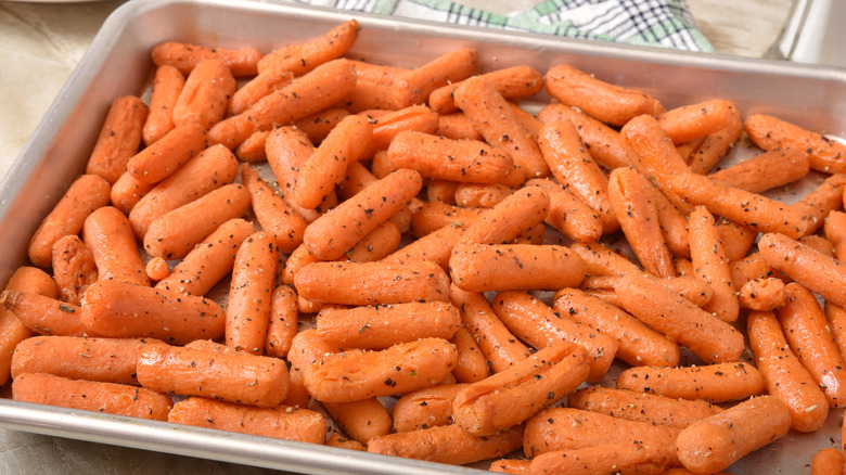 Baby carrots on a roasting pan