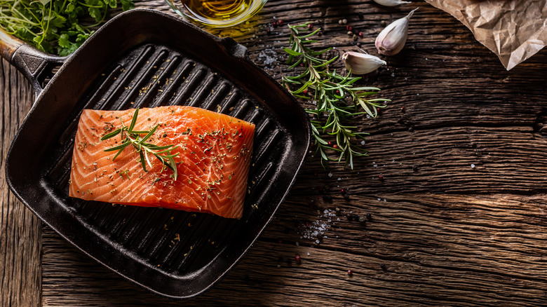 Raw salmon fillet on a grill pan