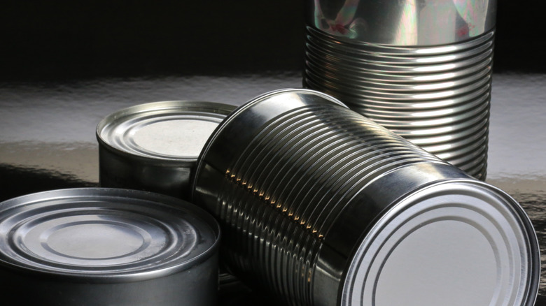 Canned goods, some of them stored on their side