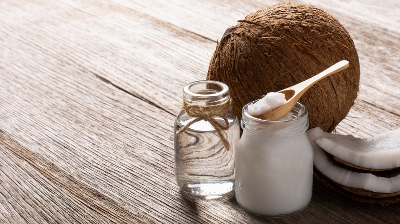 Jars of liquid and solid coconut oil