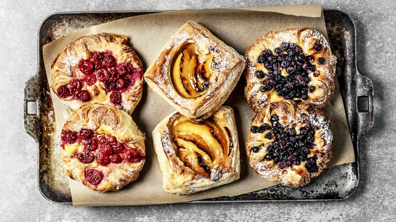 Assorted fruit pastries on baking tray