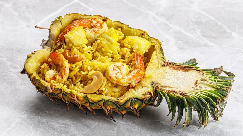 Thai pineapple fried rice with shrimp served in a halved pineapple