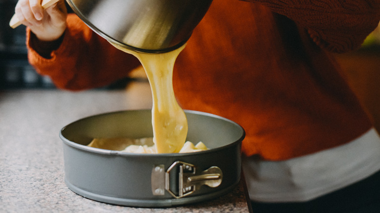 Pouring cake mix into bake pan