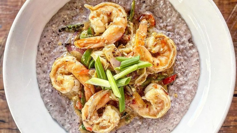 Bowl of blue grits and shrimp