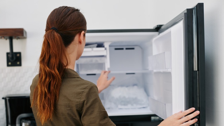 Person opening freezer
