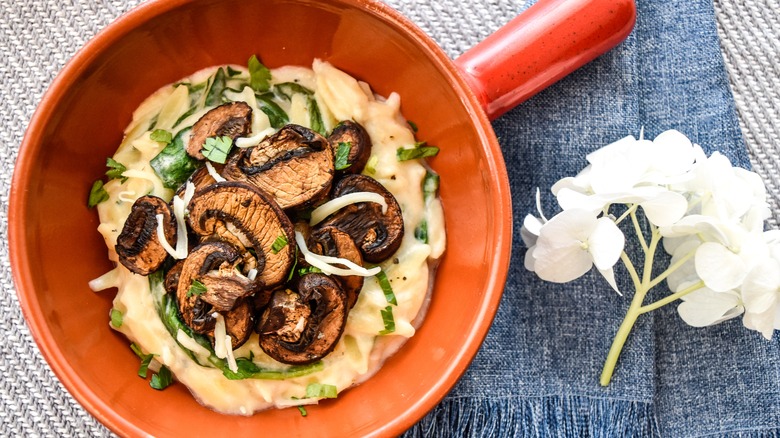 Dutch oven of creamy orzo with mushrooms
