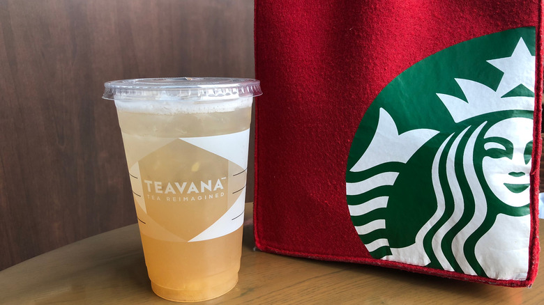 Starbucks teavana tea next to Starbucks tote bag