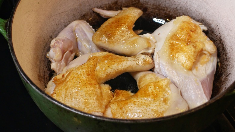 browning chicken pieces in dutch oven